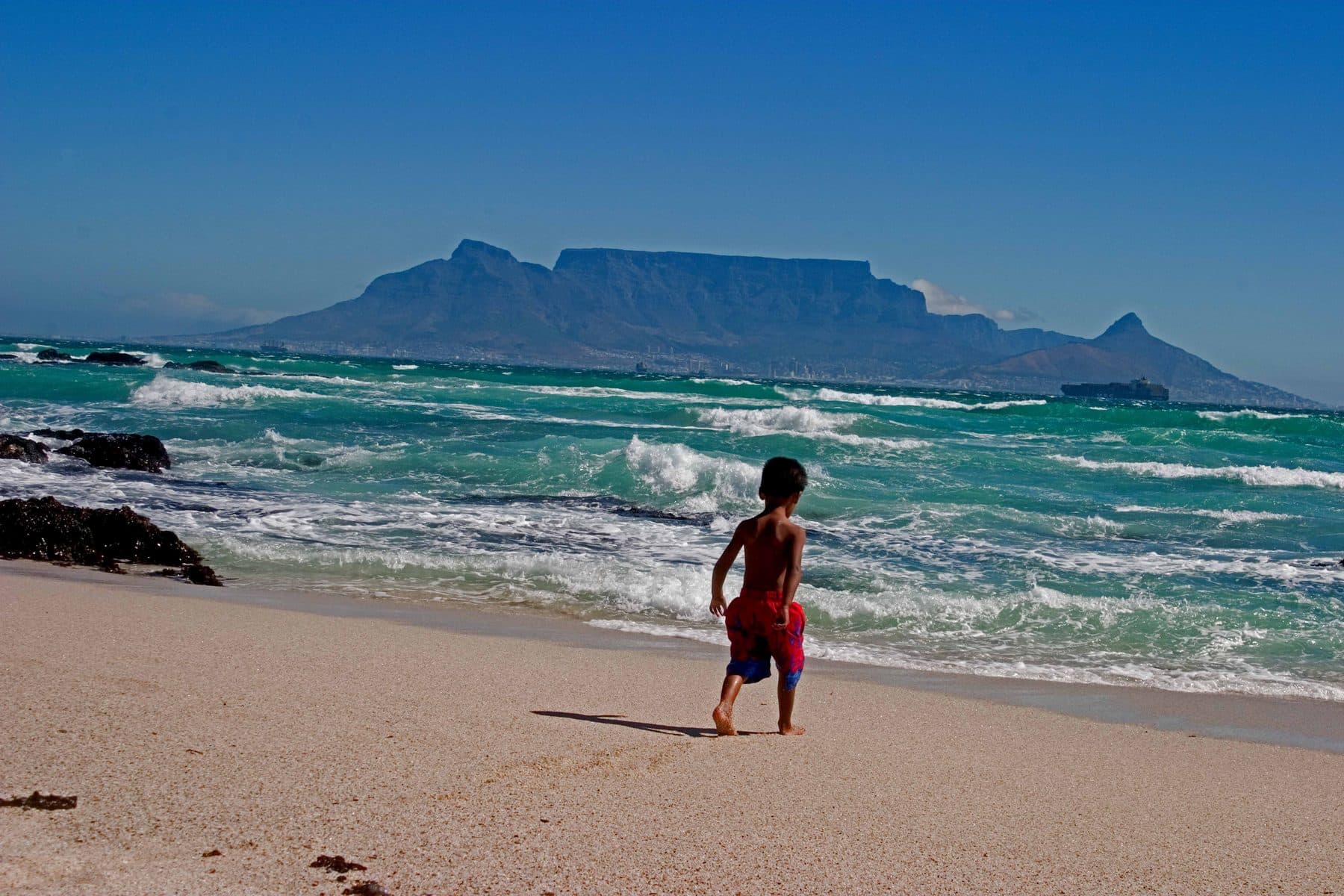 Table Mountain's flat summit above Cape Town, seen from Bloubergstrand beach