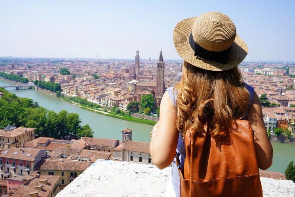 View over the rooftops and river of an Italian city from a hilltop terrace
