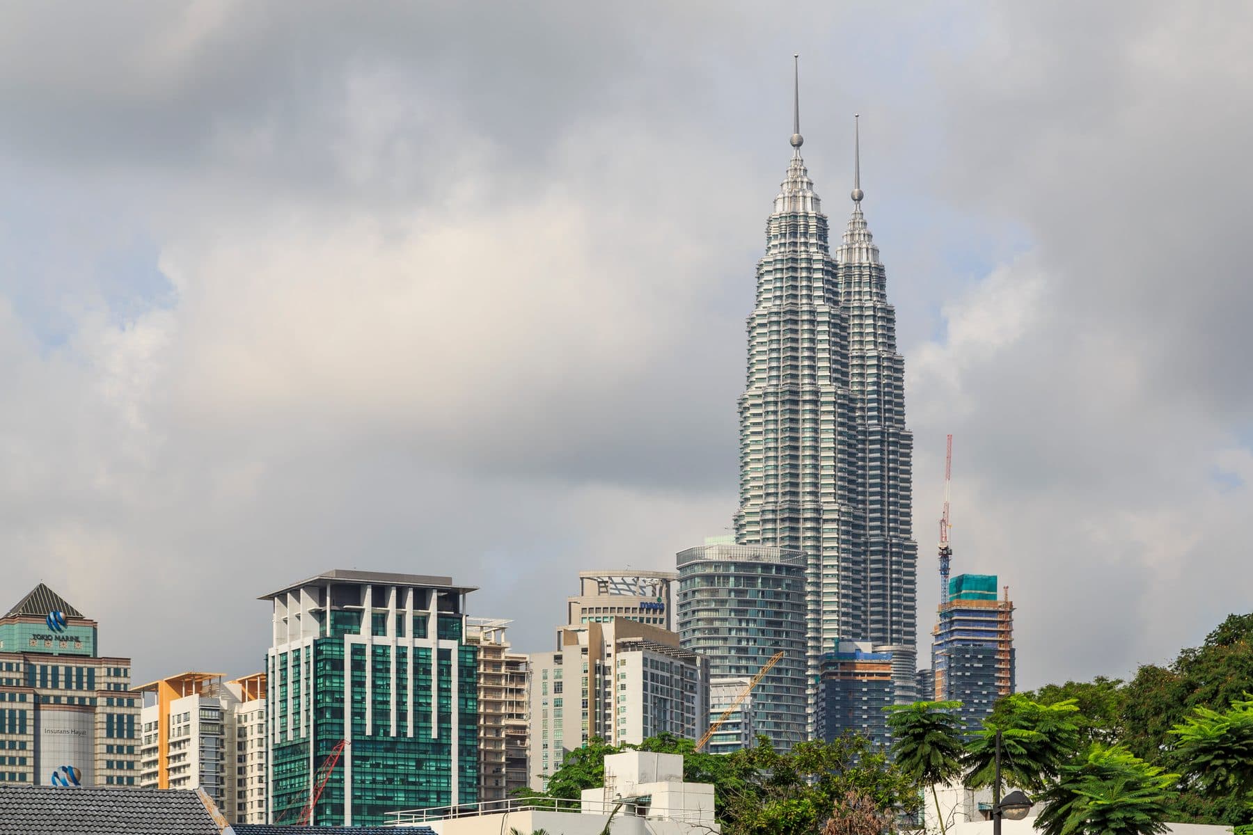 The Petronas Twin Towers rising over the Kuala Lumpur skyline